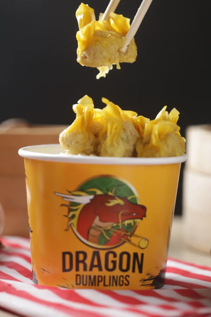 Dragon Dumplings siomai lifted from a branded cup